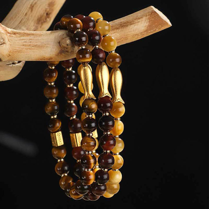 Pulsera de coraje con pez koi y ojo de tigre de Buddha Stones