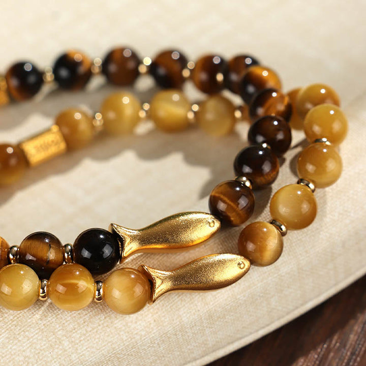 Pulsera de coraje con pez koi y ojo de tigre de Buddha Stones