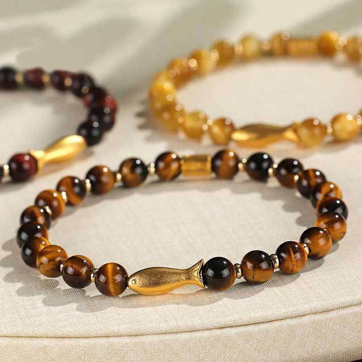 Pulsera de coraje con pez koi y ojo de tigre de Buddha Stones