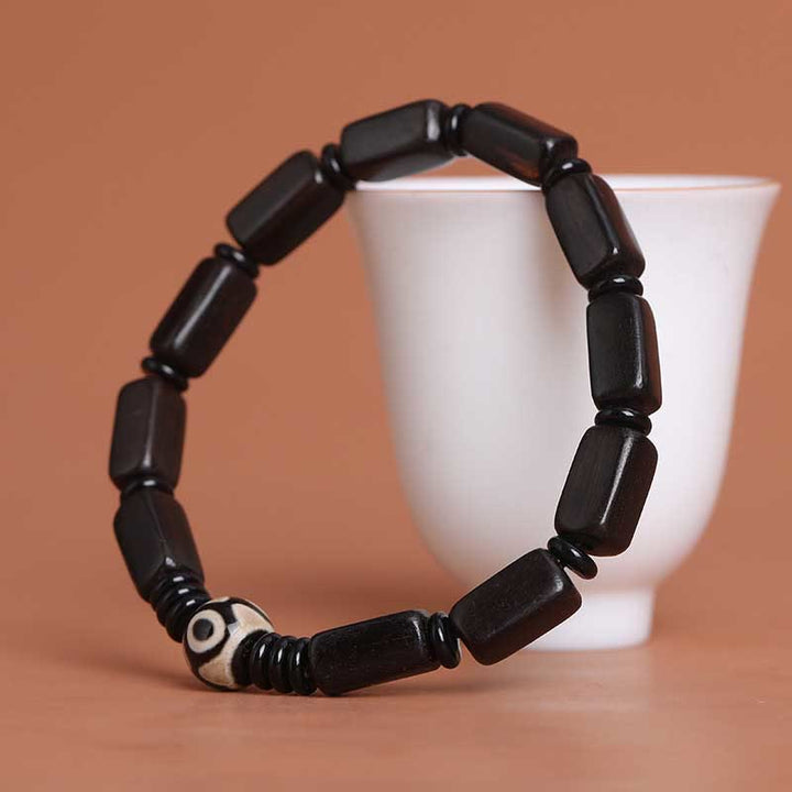 Pulsera de equilibrio con cuentas rectangulares de madera de ébano y Buddha Stones