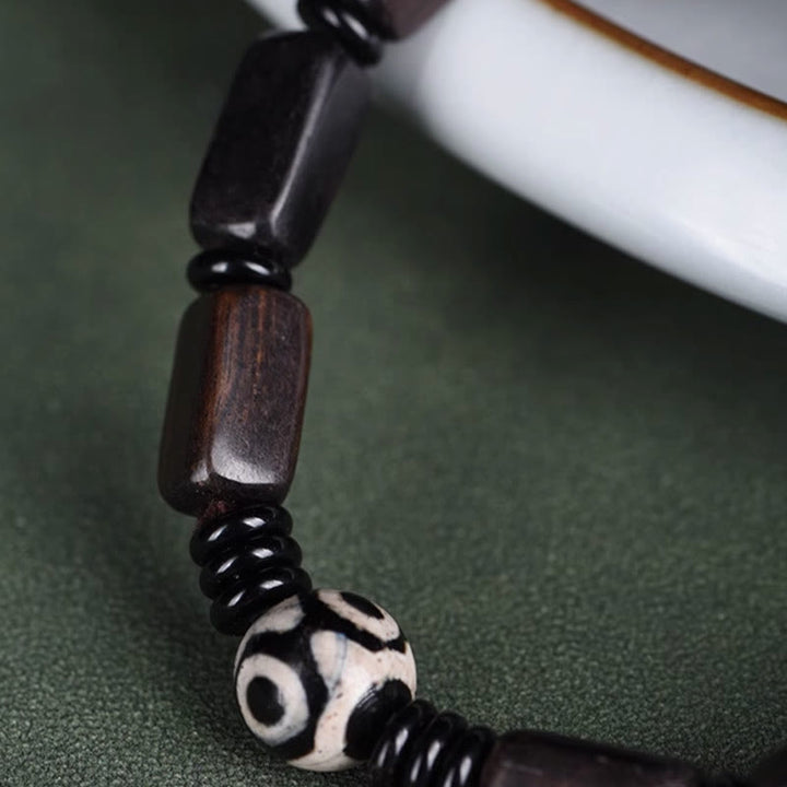 Pulsera de equilibrio con cuentas rectangulares de madera de ébano y Buddha Stones