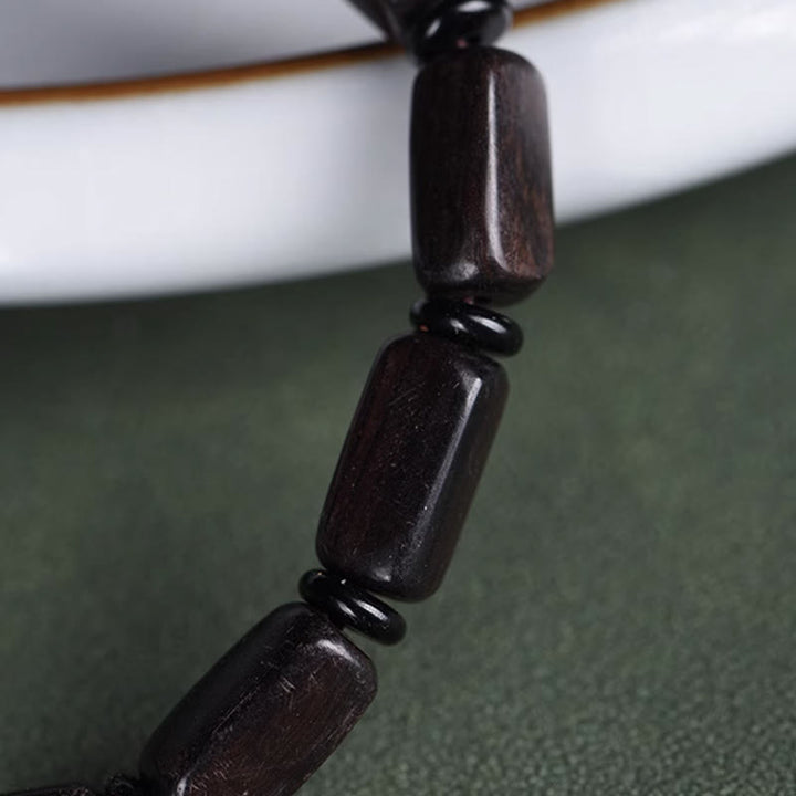 Pulsera de equilibrio con cuentas rectangulares de madera de ébano y Buddha Stones