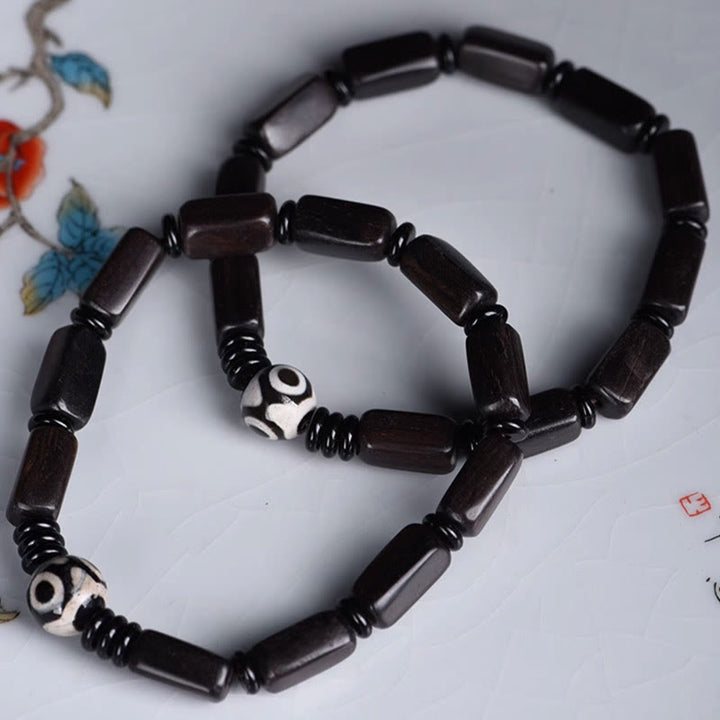 Pulsera de equilibrio con cuentas rectangulares de madera de ébano y Buddha Stones