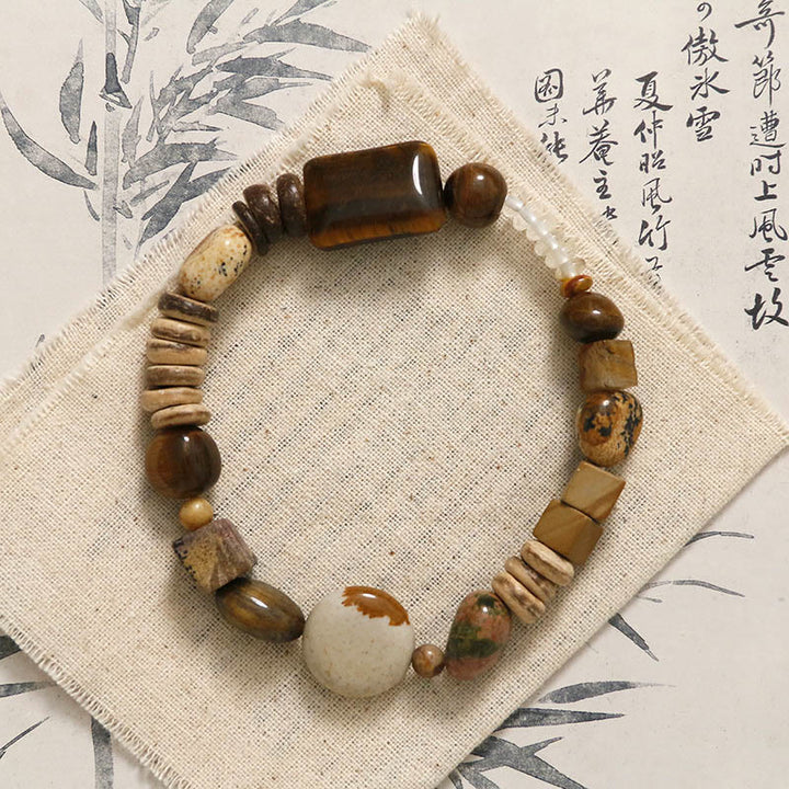 Pulsera de coraje con ojo de tigre y cáscara de coco de Buddha Stones