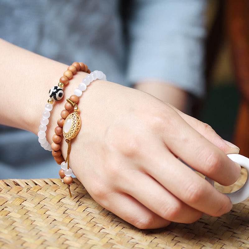 Pulsera protectora de cristal con cuentas Dzi de tres ojos y ojo de gato de sándalo y Buddha Stones