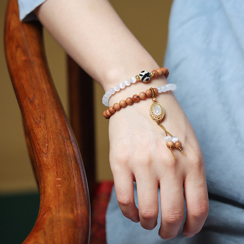 Pulsera protectora de cristal con cuentas Dzi de tres ojos y ojo de gato de sándalo y Buddha Stones