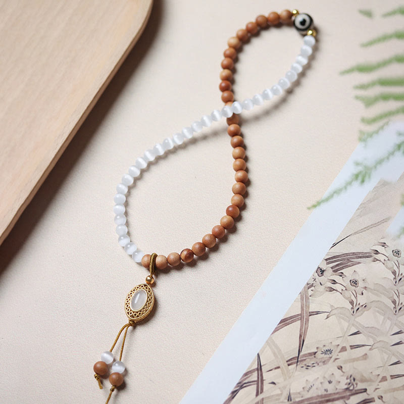 Pulsera protectora de cristal con cuentas Dzi de tres ojos y ojo de gato de sándalo y Buddha Stones