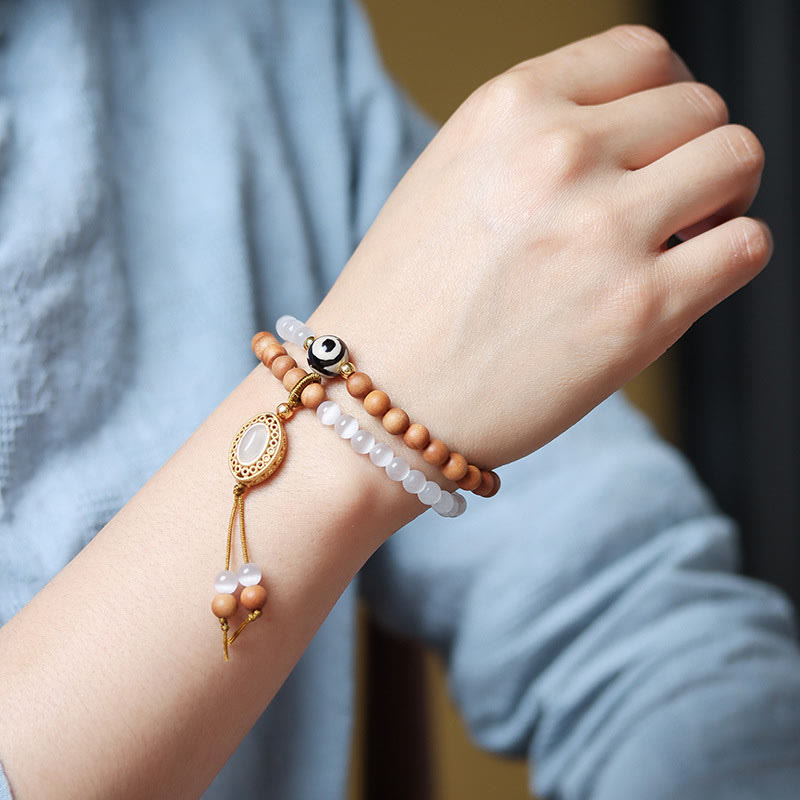 Pulsera protectora de cristal con cuentas Dzi de tres ojos y ojo de gato de sándalo y Buddha Stones