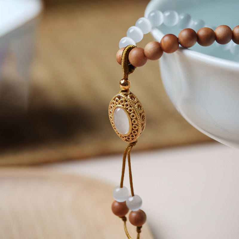 Pulsera protectora de cristal con cuentas Dzi de tres ojos y ojo de gato de sándalo y Buddha Stones