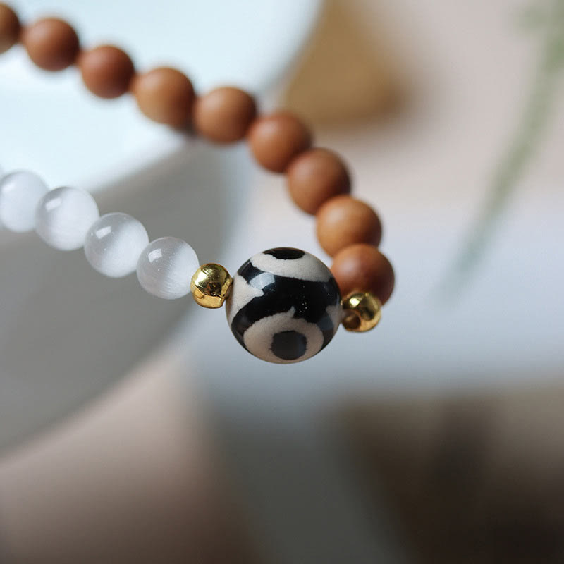 Pulsera protectora de cristal con cuentas Dzi de tres ojos y ojo de gato de sándalo y Buddha Stones