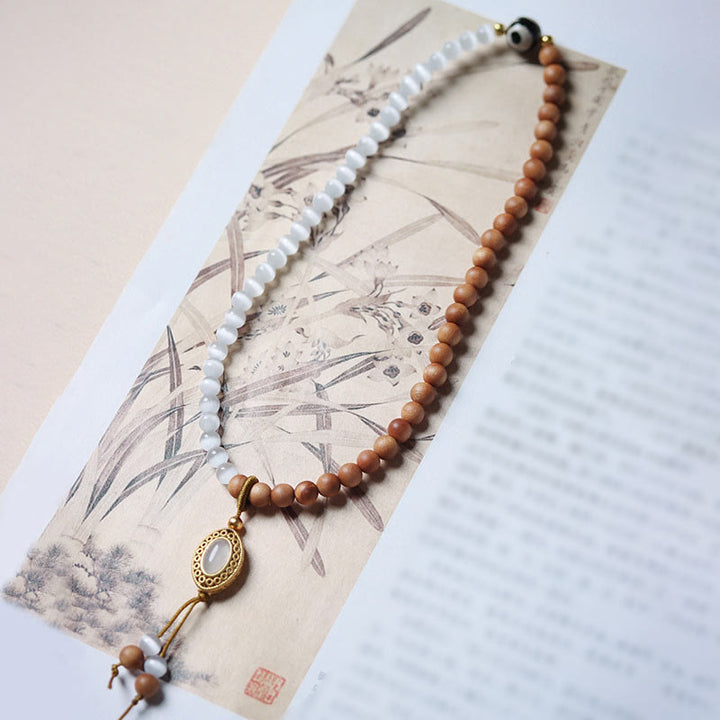 Pulsera protectora de cristal con cuentas Dzi de tres ojos y ojo de gato de sándalo y Buddha Stones