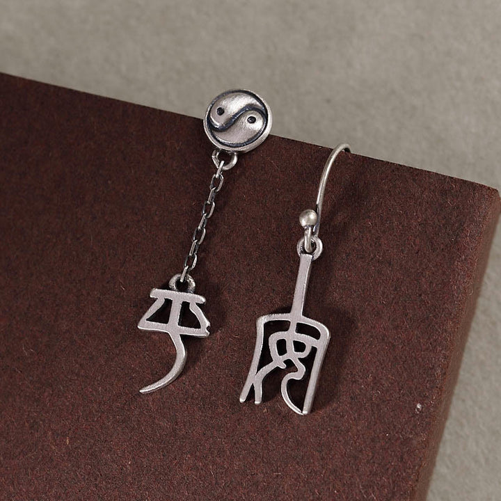 Pendientes de protección con caracteres chinos "Ping An" y "Xi Le" en plata de ley 925 con Buddha Stones