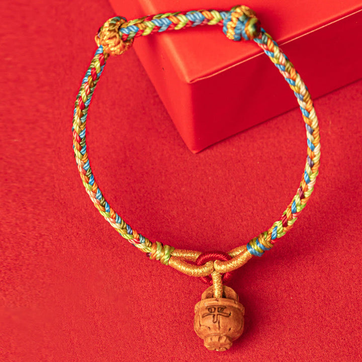 Pulsera de madera de melocotón con Buddha Stones y carácter Fu para la seguridad y la prosperidad