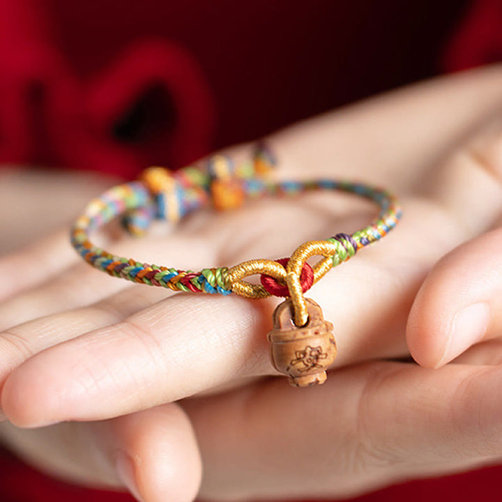 Pulsera de madera de melocotón con Buddha Stones y carácter Fu para la seguridad y la prosperidad