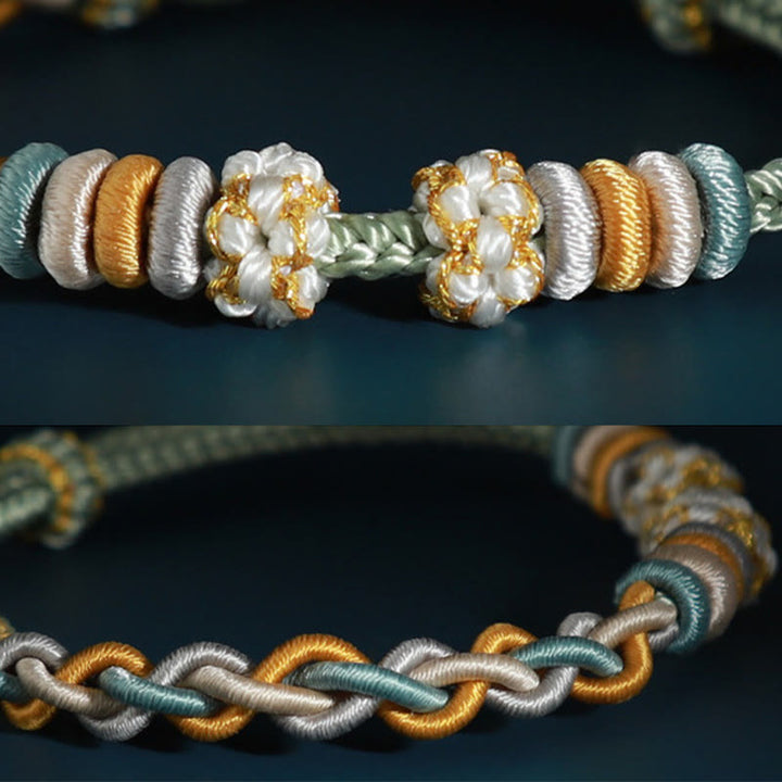 Pulsera de cuatro hilos con Buddha Stones y flor de durazno
