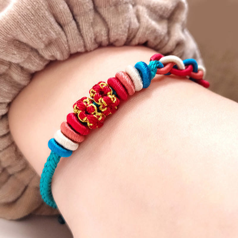 Pulsera de cuatro hilos con Buddha Stones y flor de durazno