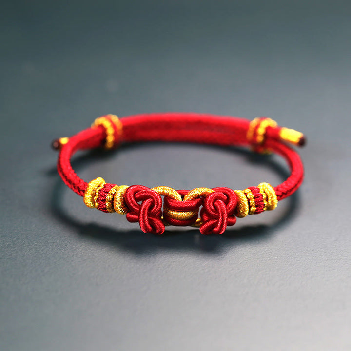 Pulsera de fuerza con nudo de silla de montar y hilo rojo de Buddha Stones