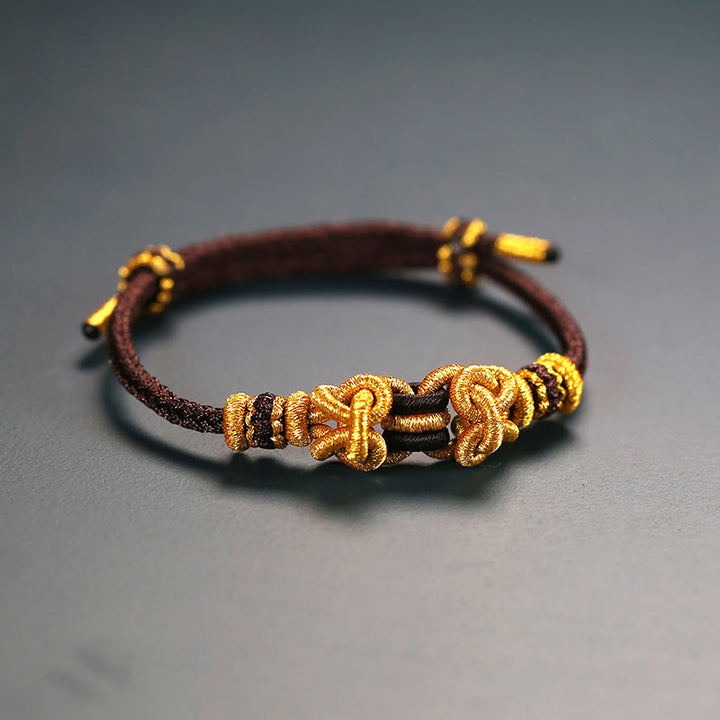 Pulsera de fuerza con nudo de silla de montar y hilo rojo de Buddha Stones