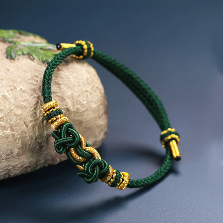 Pulsera de fuerza con nudo de silla de montar y hilo rojo de Buddha Stones
