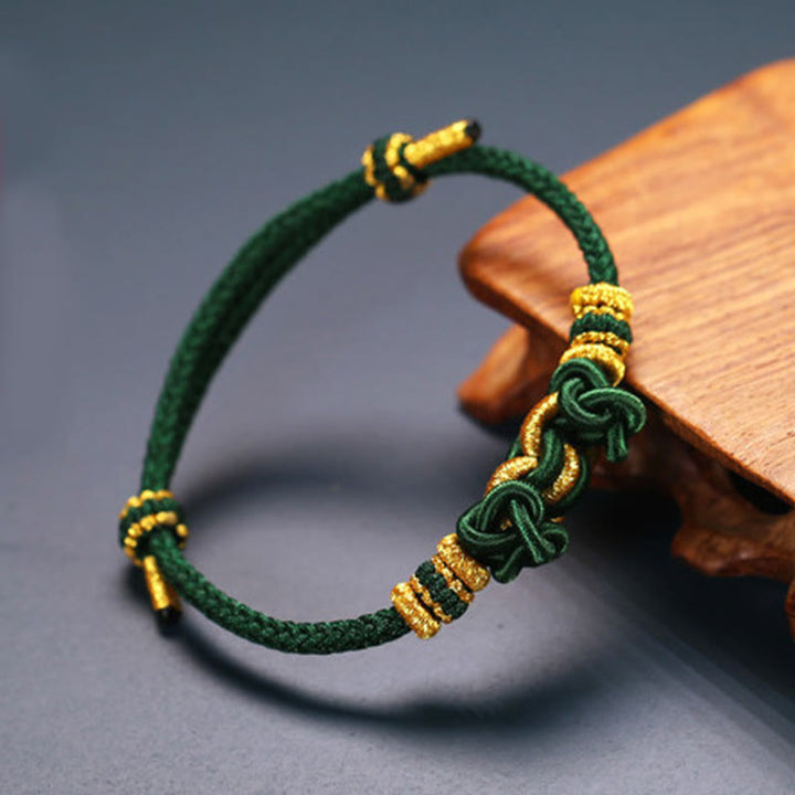 Pulsera de fuerza con nudo de silla de montar y hilo rojo de Buddha Stones
