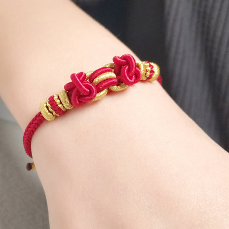 Pulsera de fuerza con nudo de silla de montar y hilo rojo de Buddha Stones