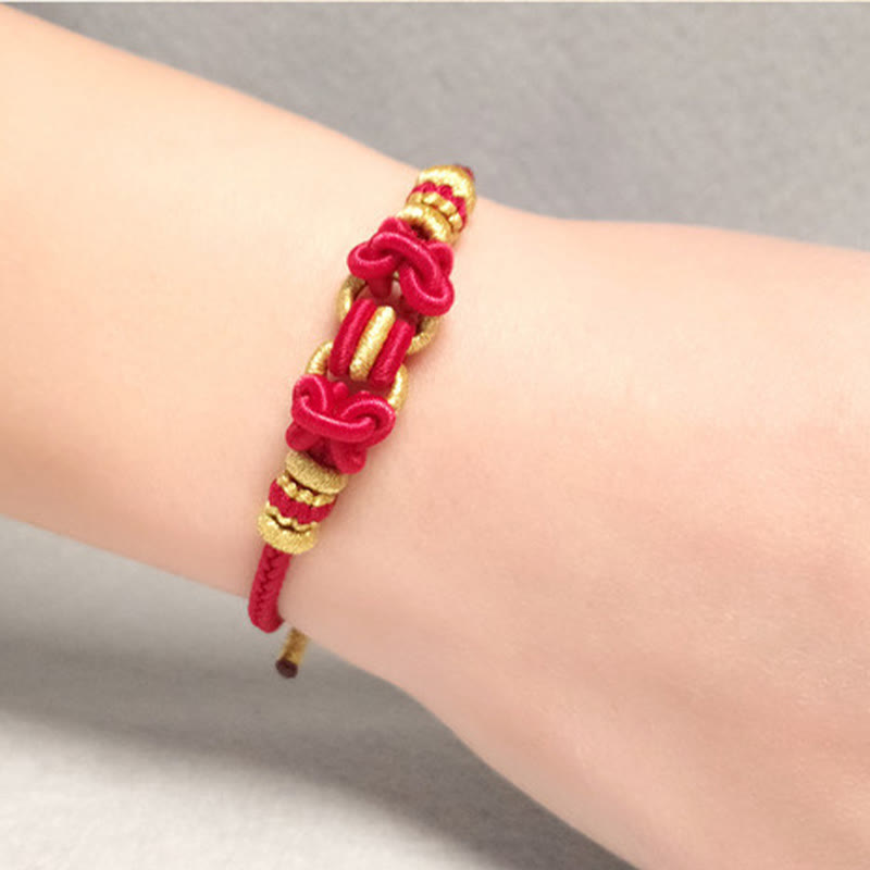 Pulsera de fuerza con nudo de silla de montar y hilo rojo de Buddha Stones