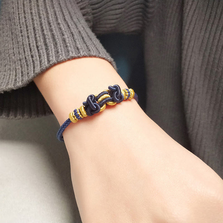 Pulsera de fuerza con nudo de silla de montar y hilo rojo de Buddha Stones