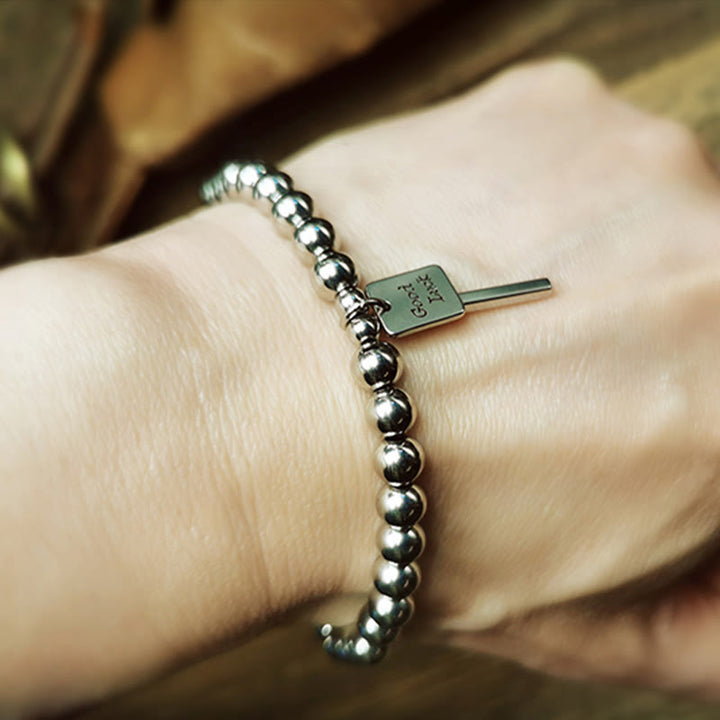 Pulsera de equilibrio de buena suerte de acero y titanio con Buddha Stones