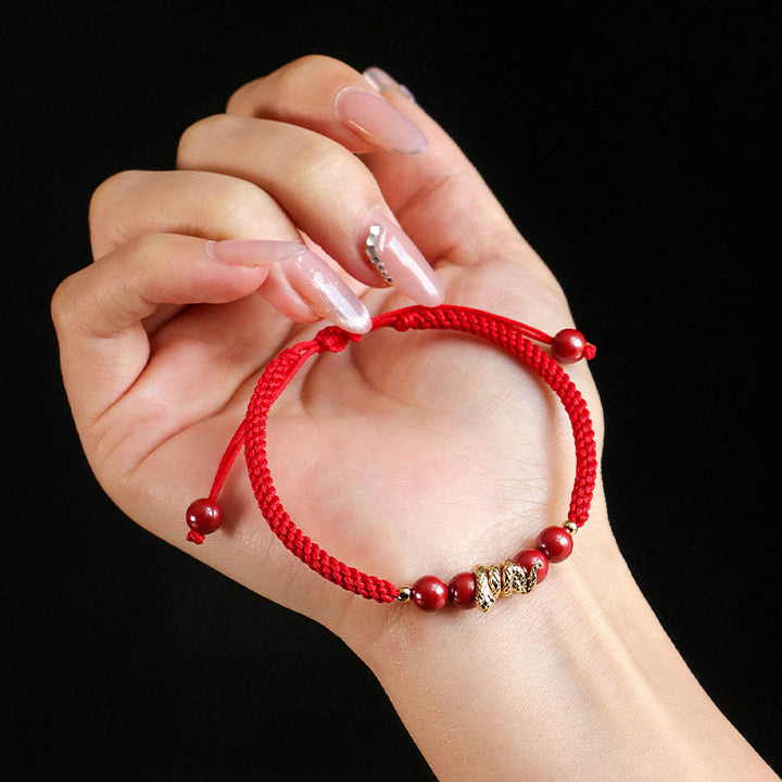 Pulsera trenzada de protección hecha a mano con Buddha Stones y cinabrio con hilo de serpiente
