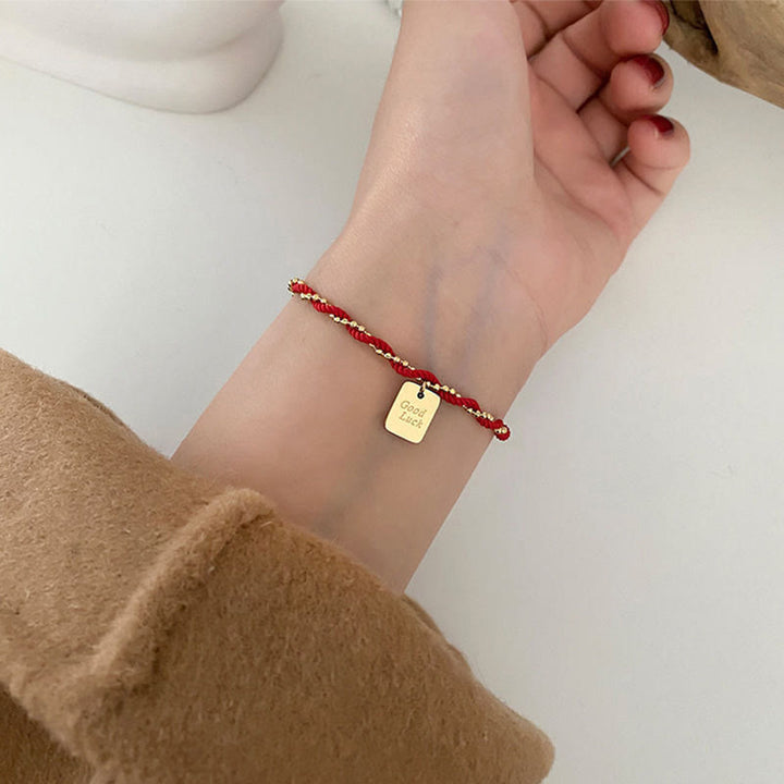 Pulsera de cobre bañada en oro con hilo rojo y Buddha Stones para la buena suerte y la fuerza