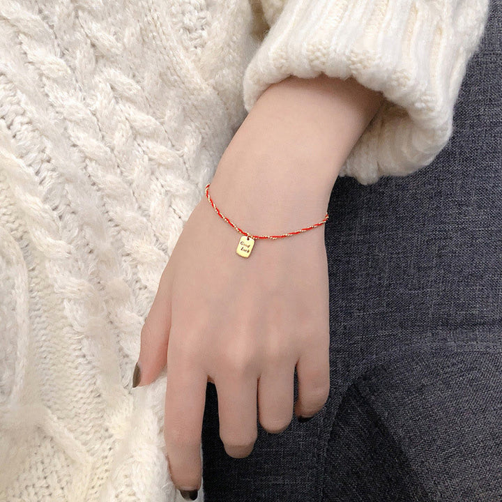 Pulsera de cobre bañada en oro con hilo rojo y Buddha Stones para la buena suerte y la fuerza