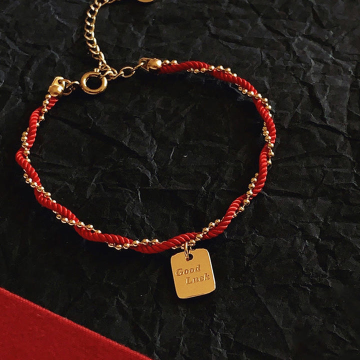 Pulsera de cobre bañada en oro con hilo rojo y Buddha Stones para la buena suerte y la fuerza