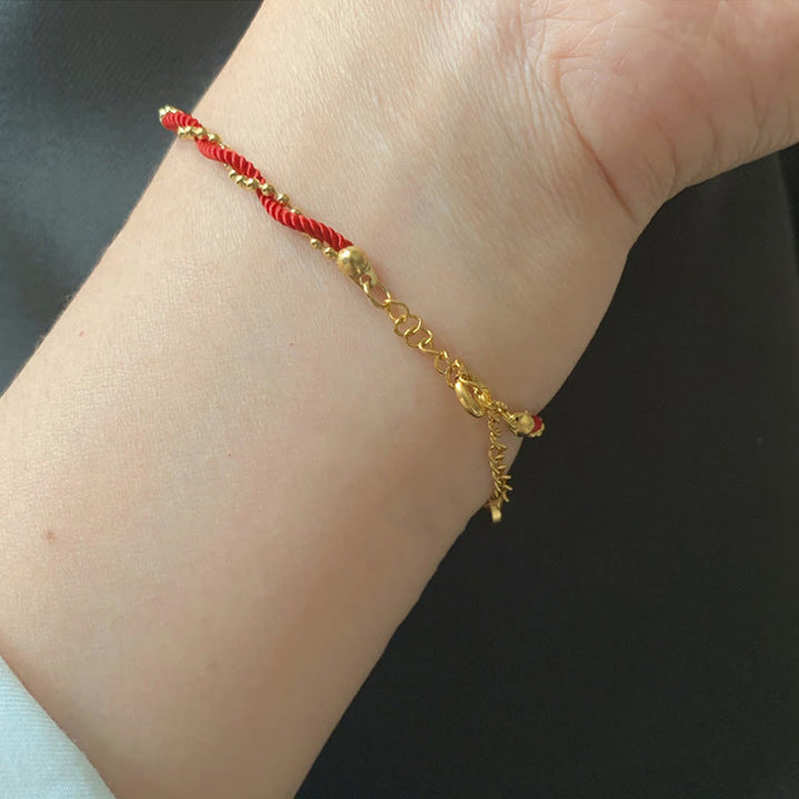 Pulsera de cobre bañada en oro con hilo rojo y Buddha Stones para la buena suerte y la fuerza