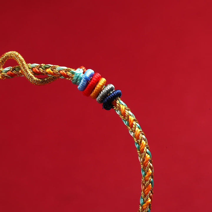 Pulsera trenzada de protección del año de la serpiente con hilo rojo y Buddha Stones