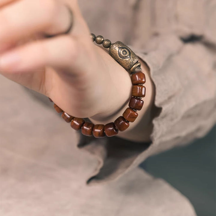 Pulsera de fuerza con colgante de cono de cobre en forma de Dzi y hueso de yak con Buddha Stones