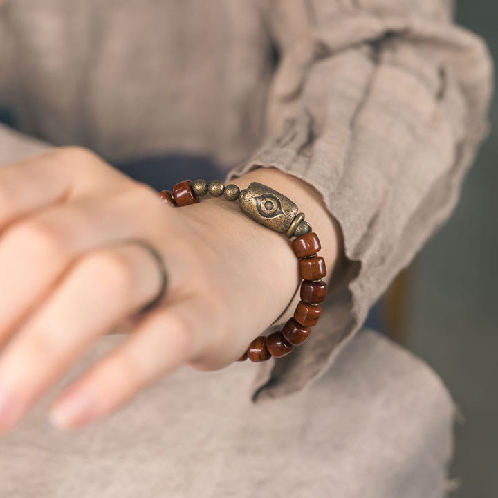 Pulsera de fuerza con colgante de cono de cobre en forma de Dzi y hueso de yak con Buddha Stones