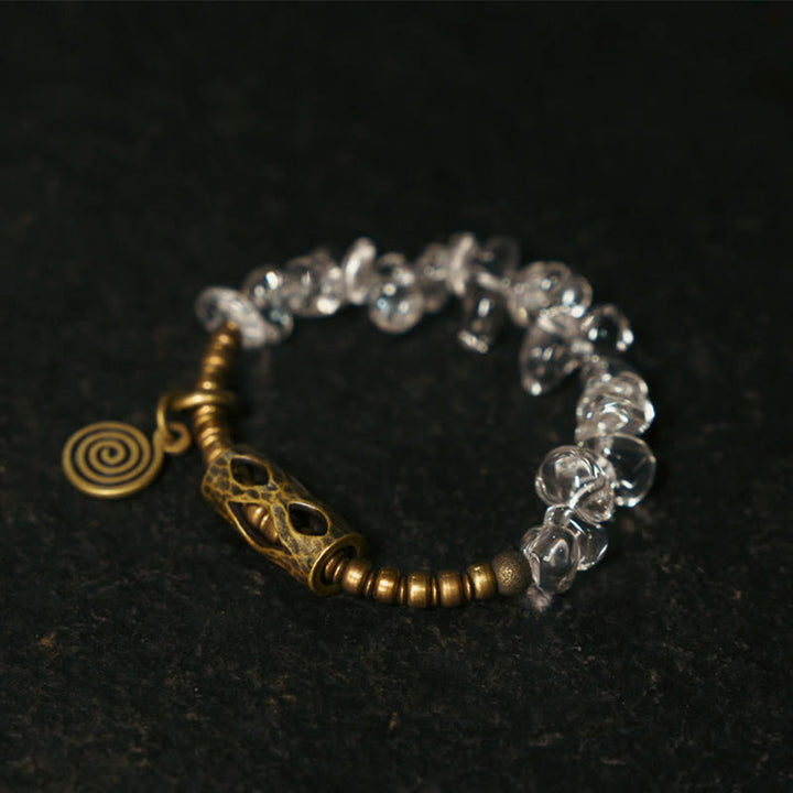 Pulsera de cobre con cristales blancos irregulares y Buddha Stones