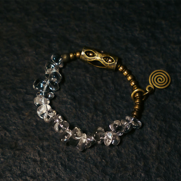 Pulsera de cobre con cristales blancos irregulares y Buddha Stones
