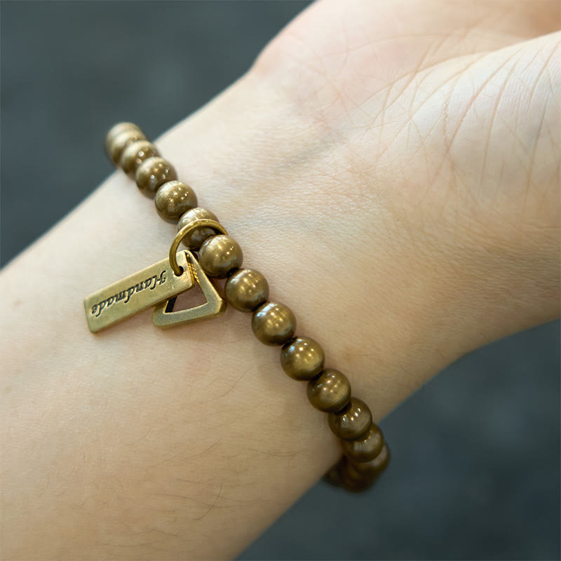 Pulsera de equilibrio con cuentas de cobre y Buddha Stones