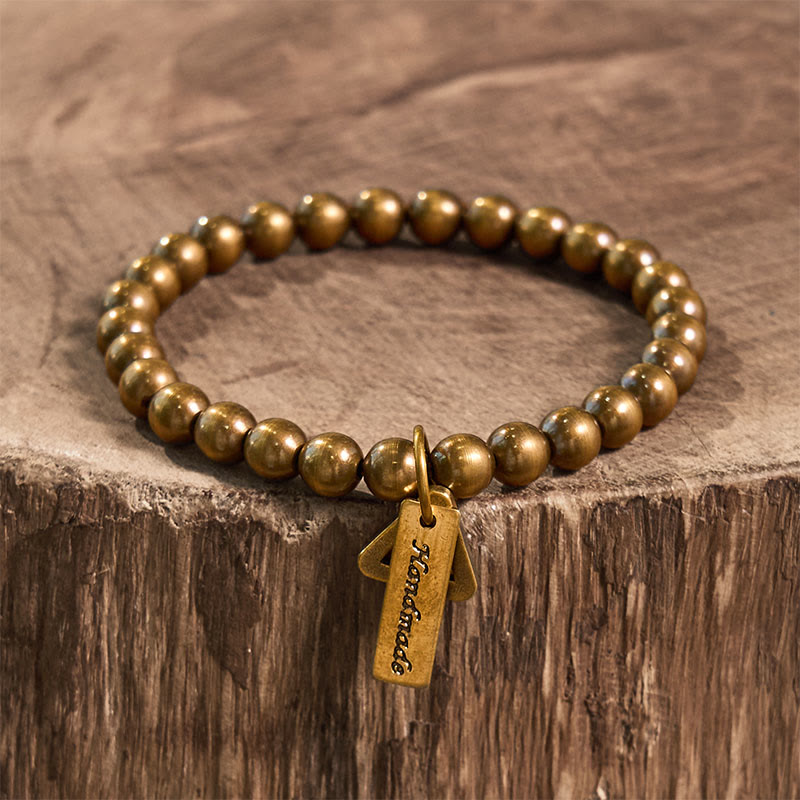 Pulsera de equilibrio con cuentas de cobre y Buddha Stones