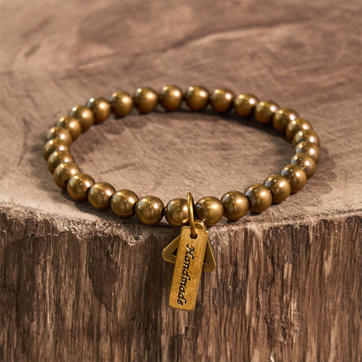 Pulsera de equilibrio con cuentas de cobre y Buddha Stones