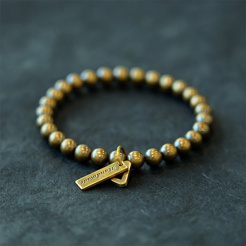 Pulsera de equilibrio con cuentas de cobre y Buddha Stones