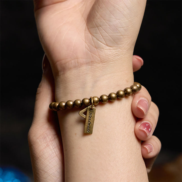 Pulsera de equilibrio con cuentas de cobre y Buddha Stones