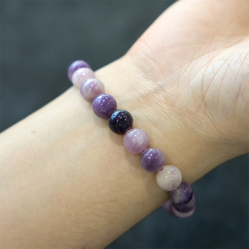 Pulsera positiva con piedra de mica morada y Buddha Stones