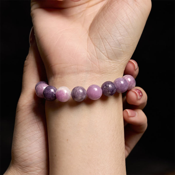 Pulsera positiva con piedra de mica morada y Buddha Stones