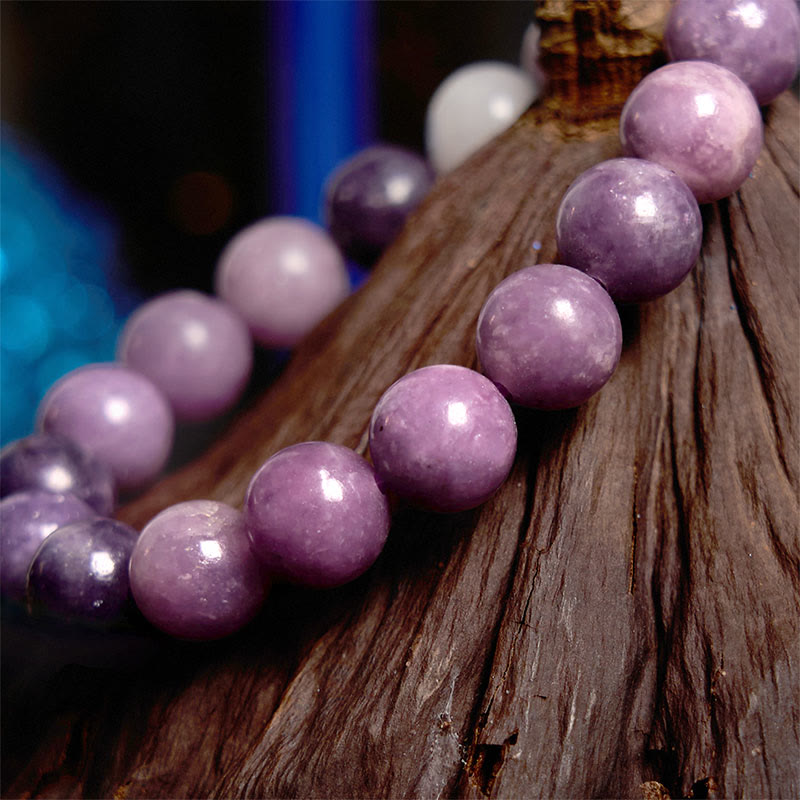 Pulsera positiva con piedra de mica morada y Buddha Stones
