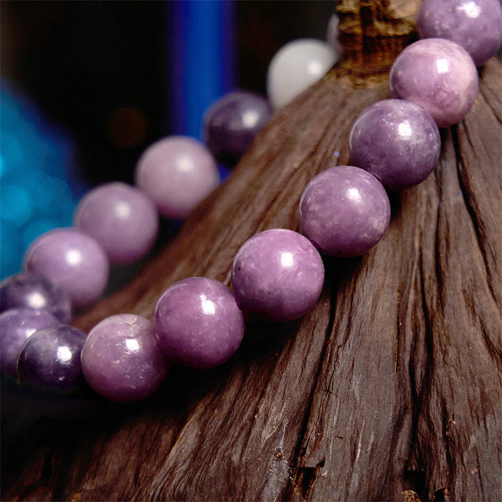 Pulsera positiva con piedra de mica morada y Buddha Stones