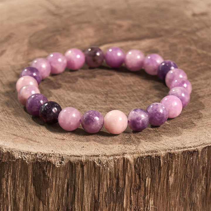 Pulsera positiva con piedra de mica morada y Buddha Stones