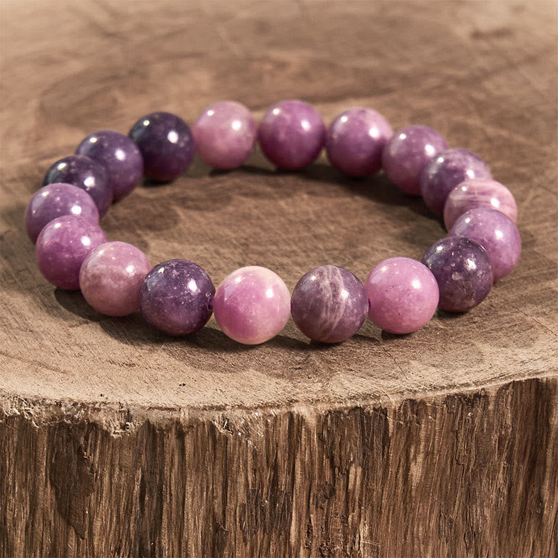 Pulsera positiva con piedra de mica morada y Buddha Stones