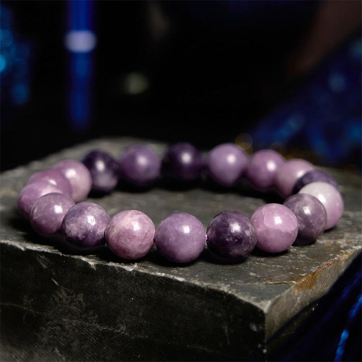 Pulsera positiva con piedra de mica morada y Buddha Stones